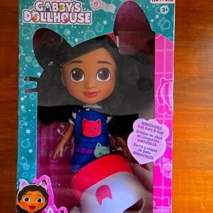 Gabbys DollHouse Vibrant Pink and Black Hairstyle Doll with Big Eyes and Navy Ou